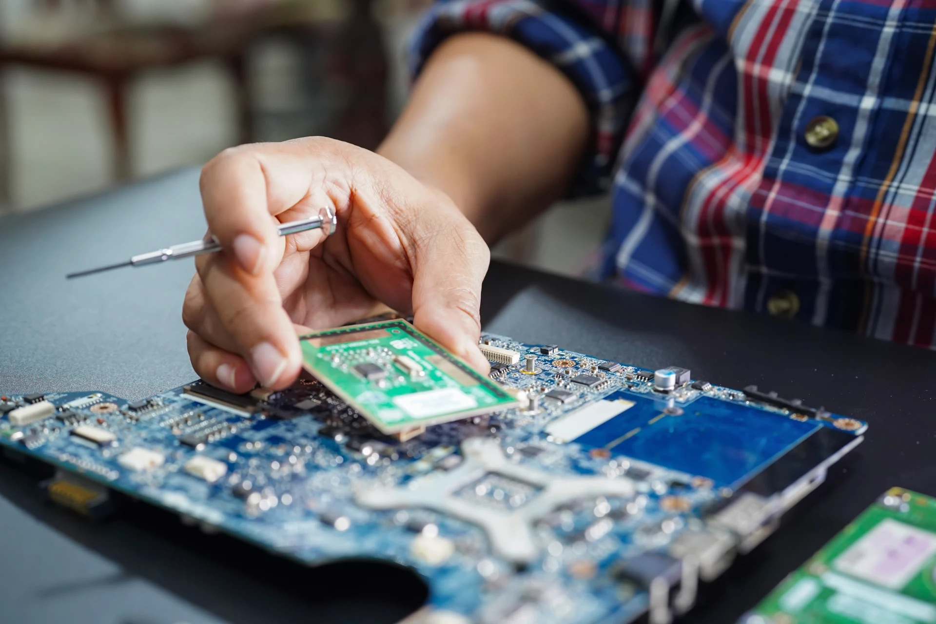asian-technician-repairing-micro-circuit-main-board-computer.webp