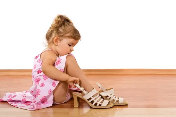 depositphotos6409567-stock-photo-trying-moms-shoes.webp